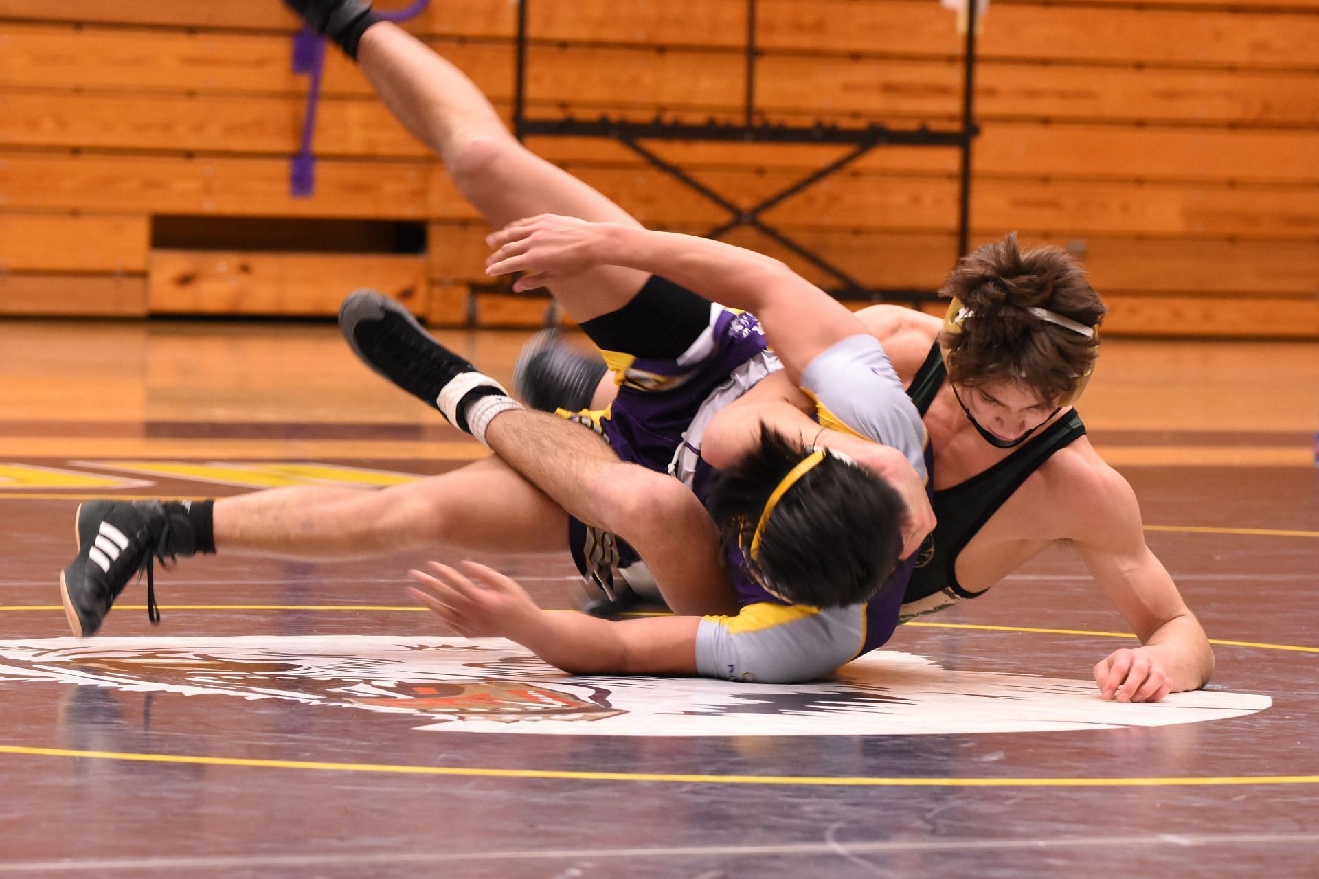 Try exercises to get better at wrestling. (Image via unsplash/Chris Chow)