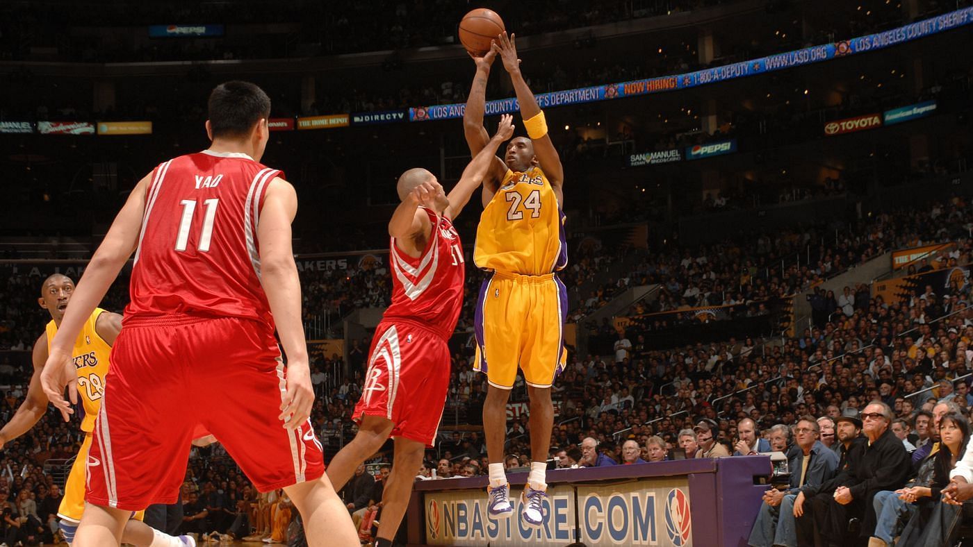 Yao Ming of the Houston Rockets watches Shane Battier guard Kobe Bryant of the LA Lakers.