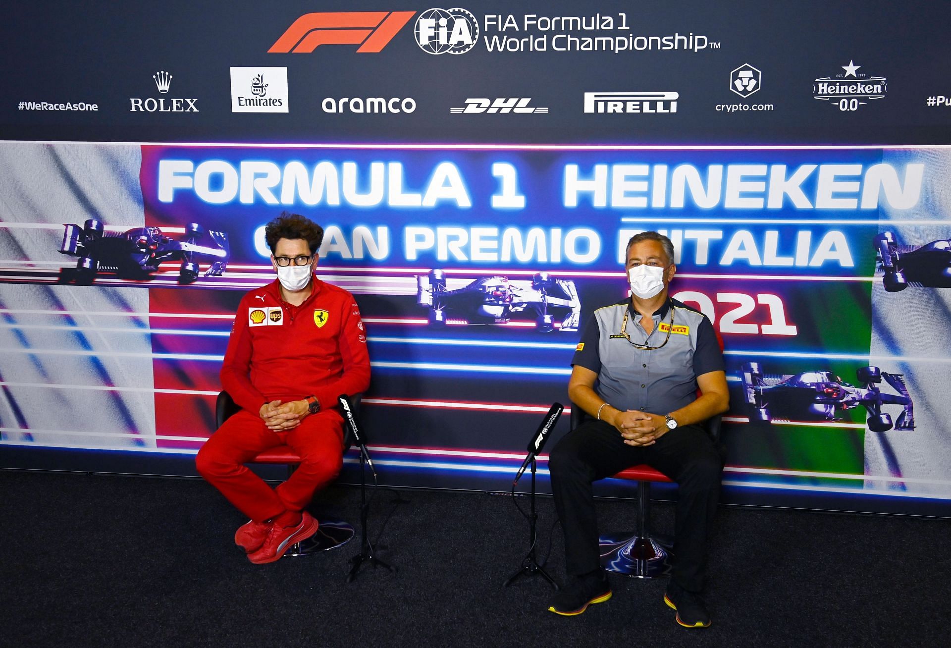 Ferrari team principal Mattia Binotto (left) and Pirelli Motorsports Director Mario Isola (right) speak to the media during the 2021 F1 Italian GP weekend (Photo by Mark Sutton - Pool/Getty Images)