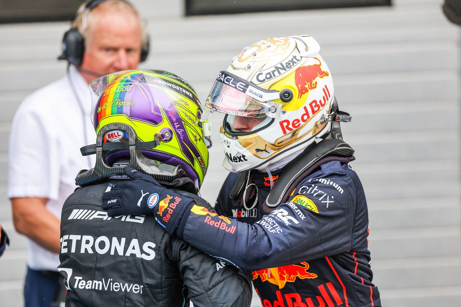 Mercedes driver Lewis Hamilton (left) and Red Bull driver Max Verstappen (right) share a moment after the 2022 F1 Hungarian GP (Photo by Peter Fox/Getty Images)