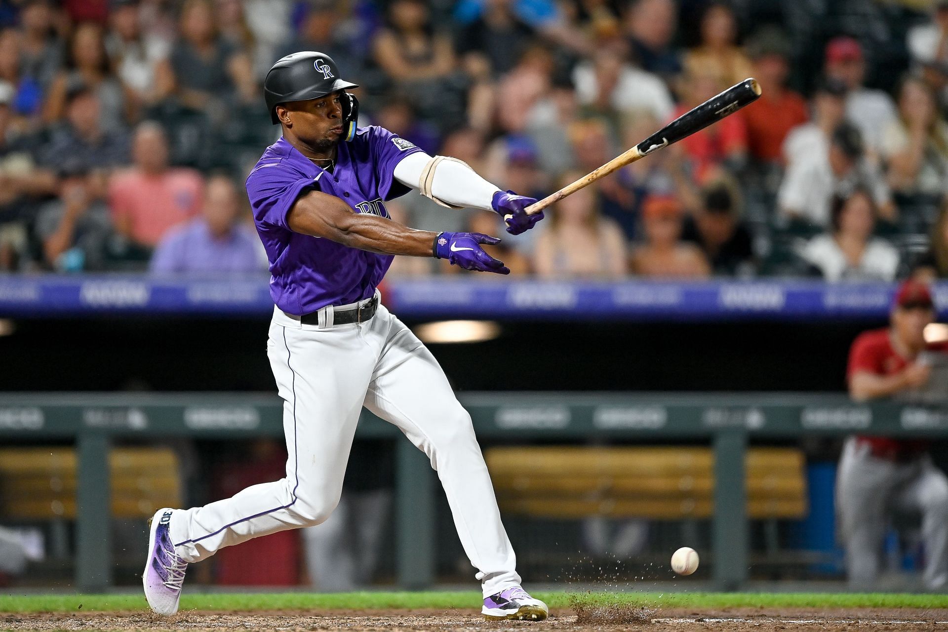 Wynton Bernard #36 of the Colorado Rockies hits a seventh inning infield single for his first career hit in his major league debut against the Arizona Diamondbacks at Coors Field on August 12, 2022