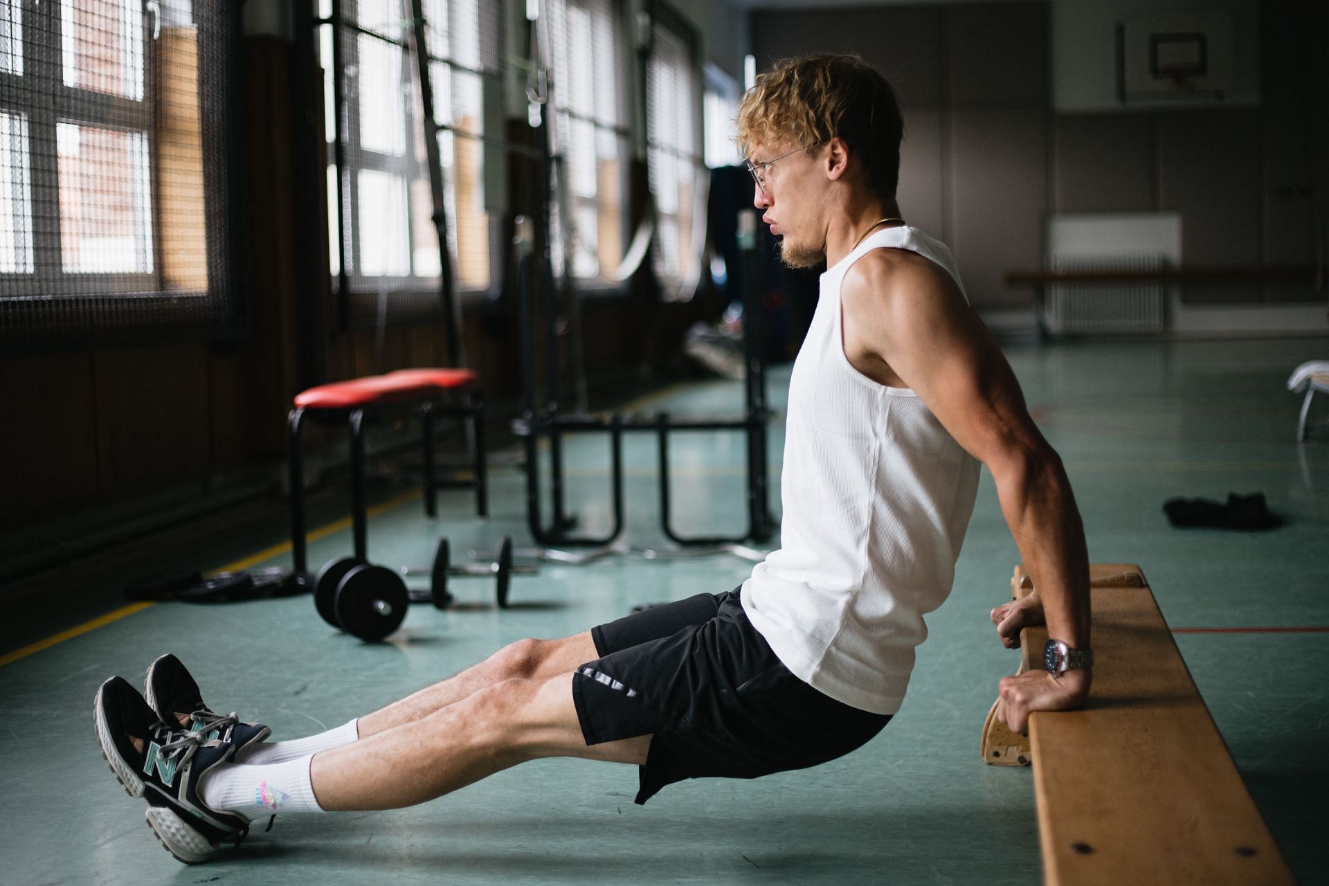 Triceps stretches can be used to ease muscle tension and speed up the healing process following an accident. (Image via Unsplash/ Sinitta Leunen)