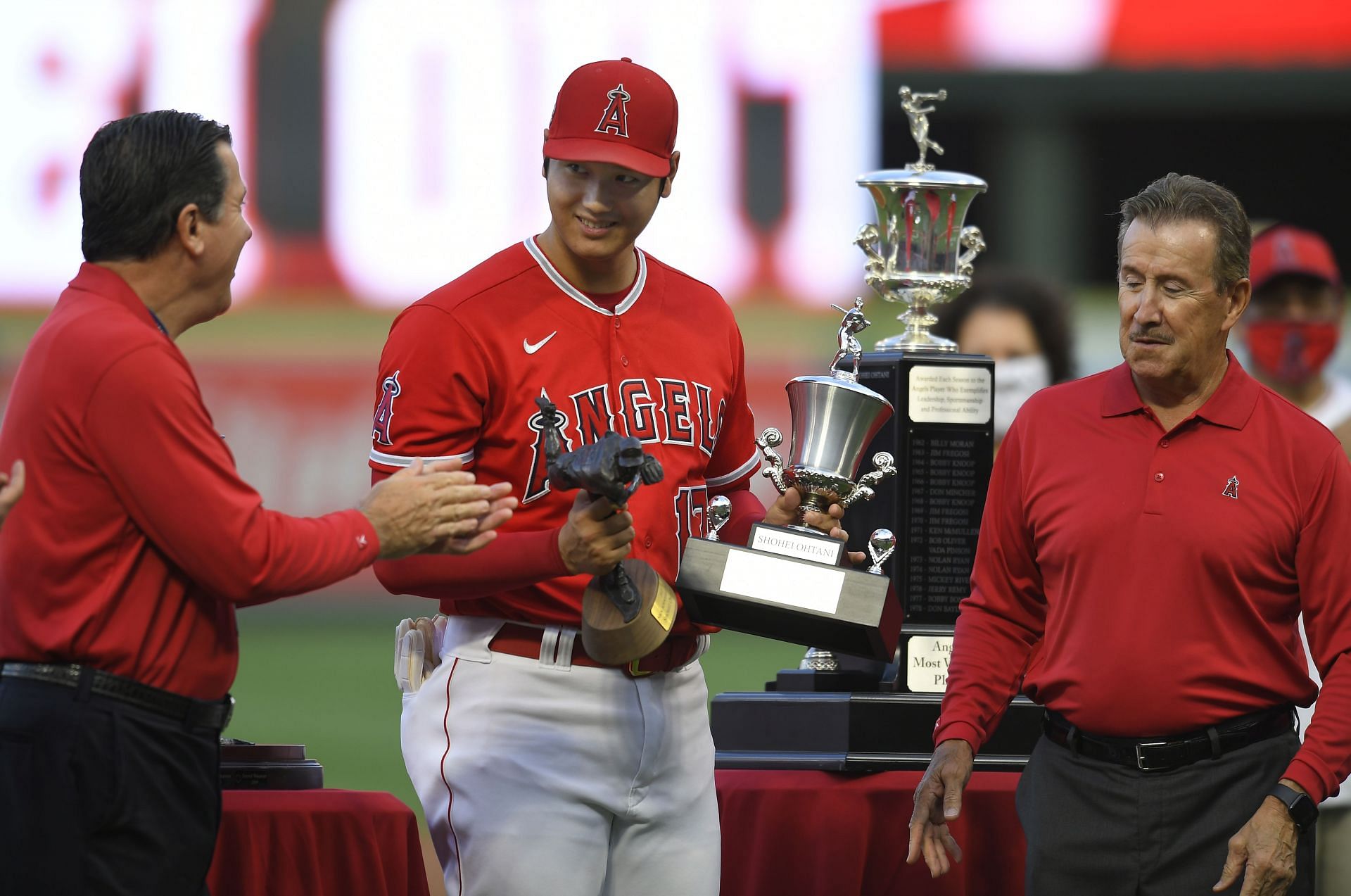 General Manager Perry Minasian, left, applauds Shohei Ohtani