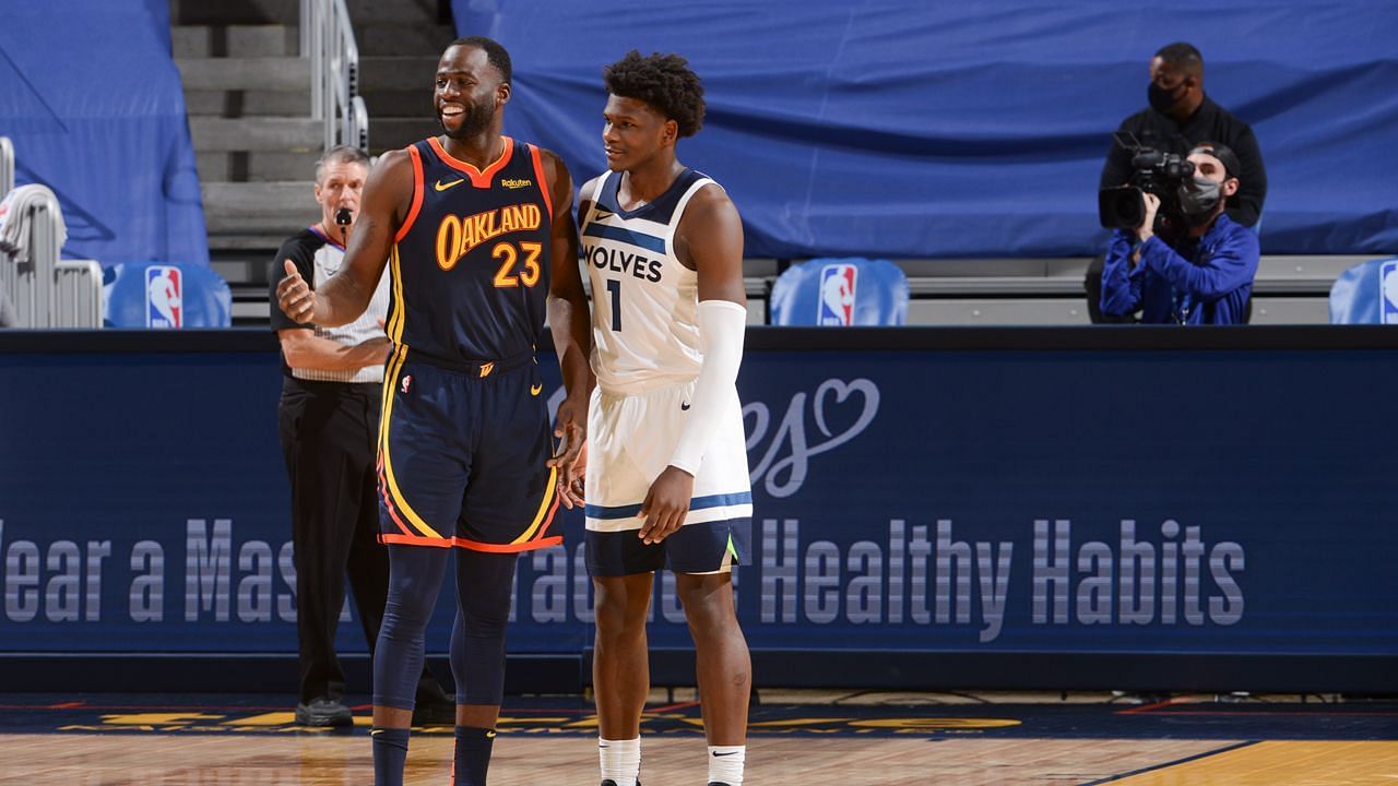 Golden State Warriors forward Draymond Green, left, and Minnesota Timberwolves guard Anthony Edwards