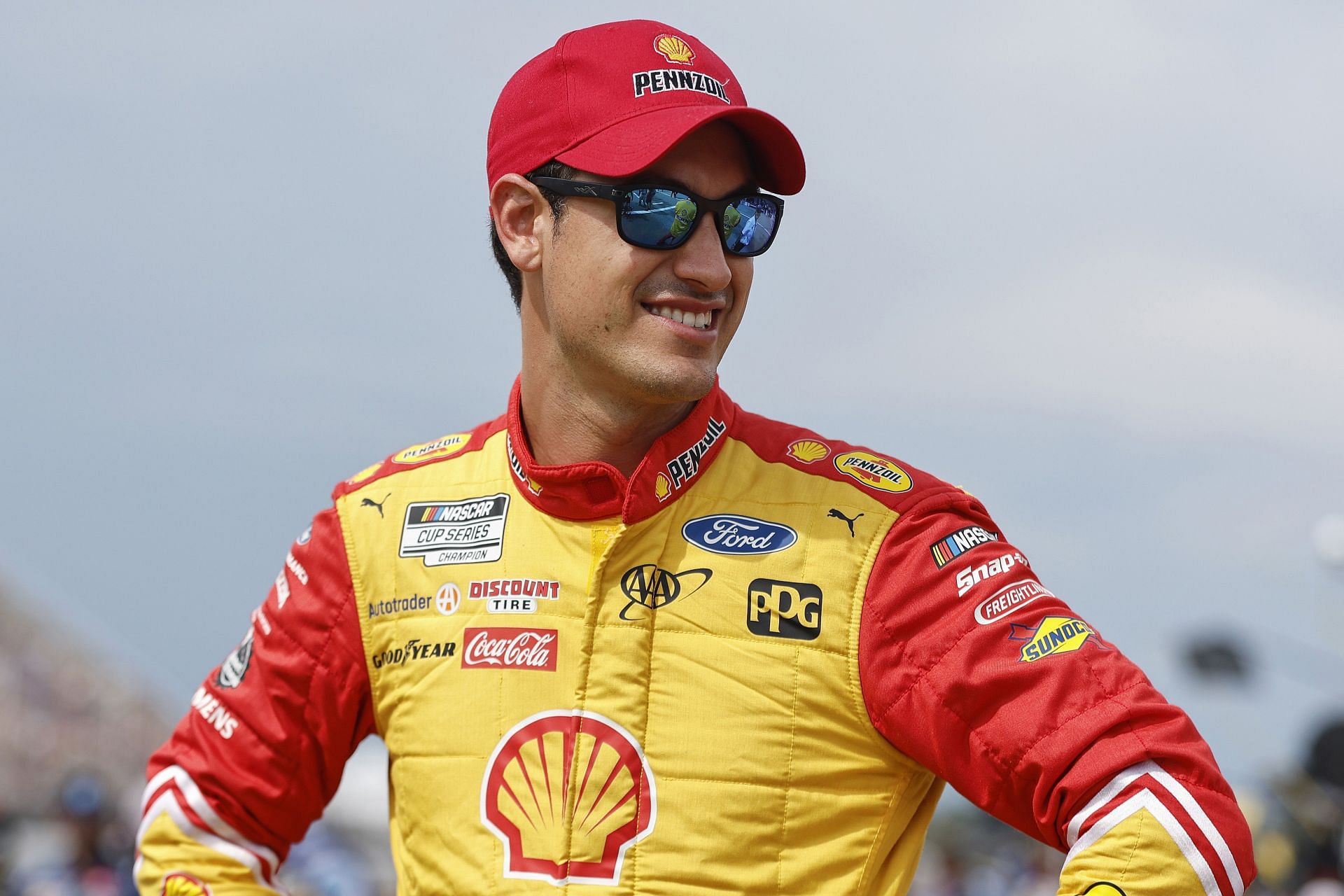 Joey Logano waits on the grid prior to the NASCAR Cup Series FireKeepers Casino 400 at Michigan International Speedway