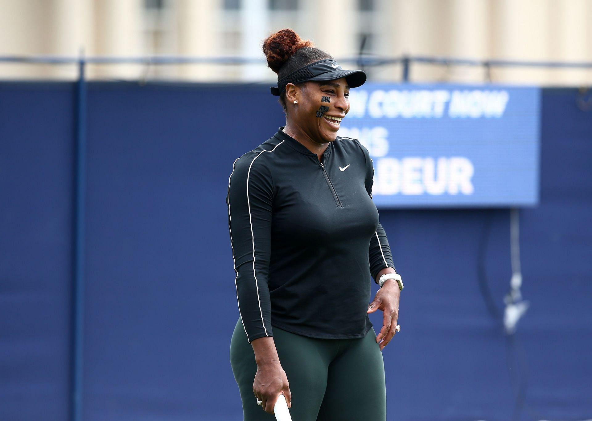 Serena Williams shares a giggle during a practice session in 2022
