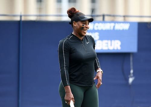 Serena Williams shares a giggle during a practice session in 2022