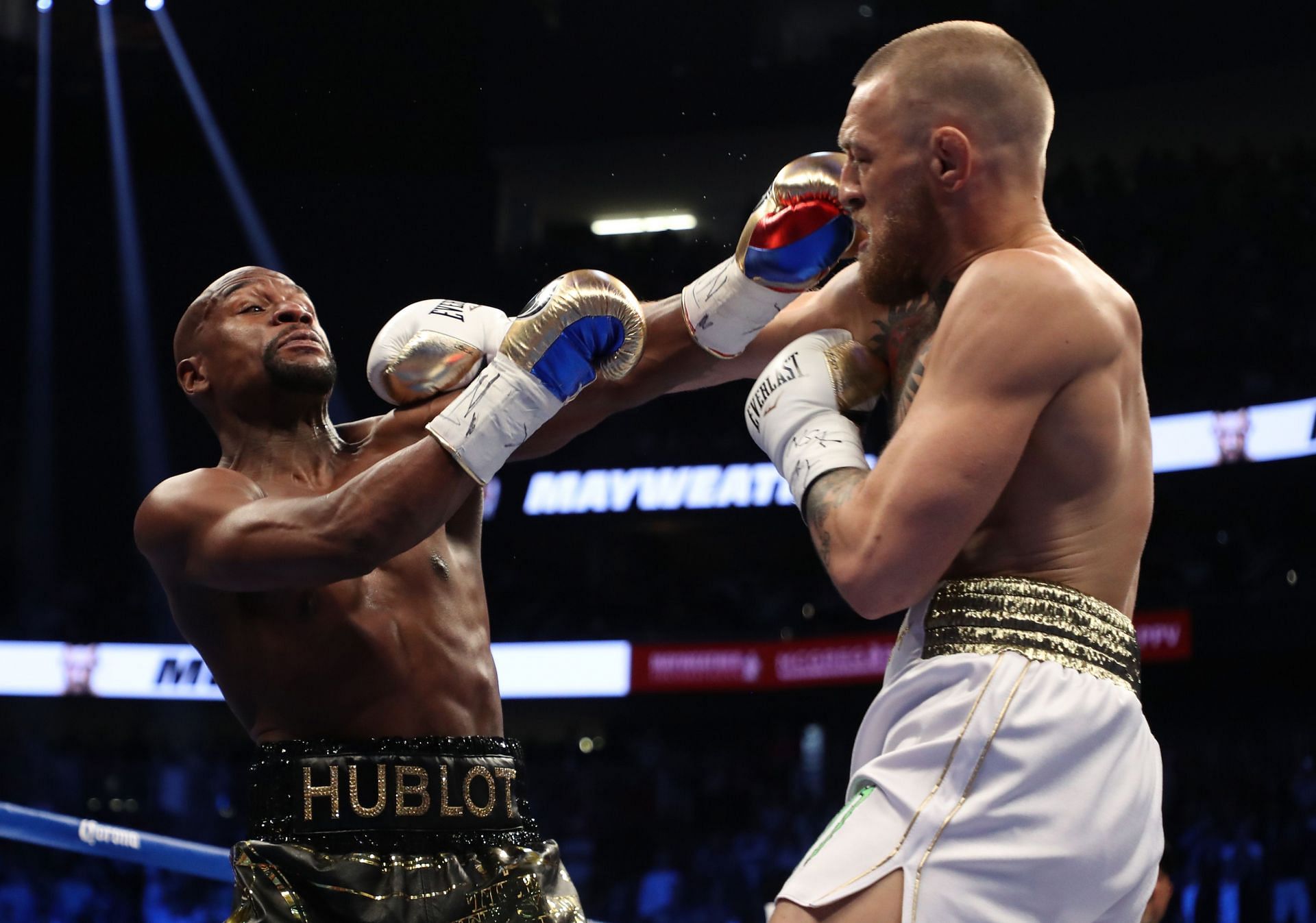 Floyd Mayweather Jr. (left) vs. Conor McGregor (right) - Via Getty Images