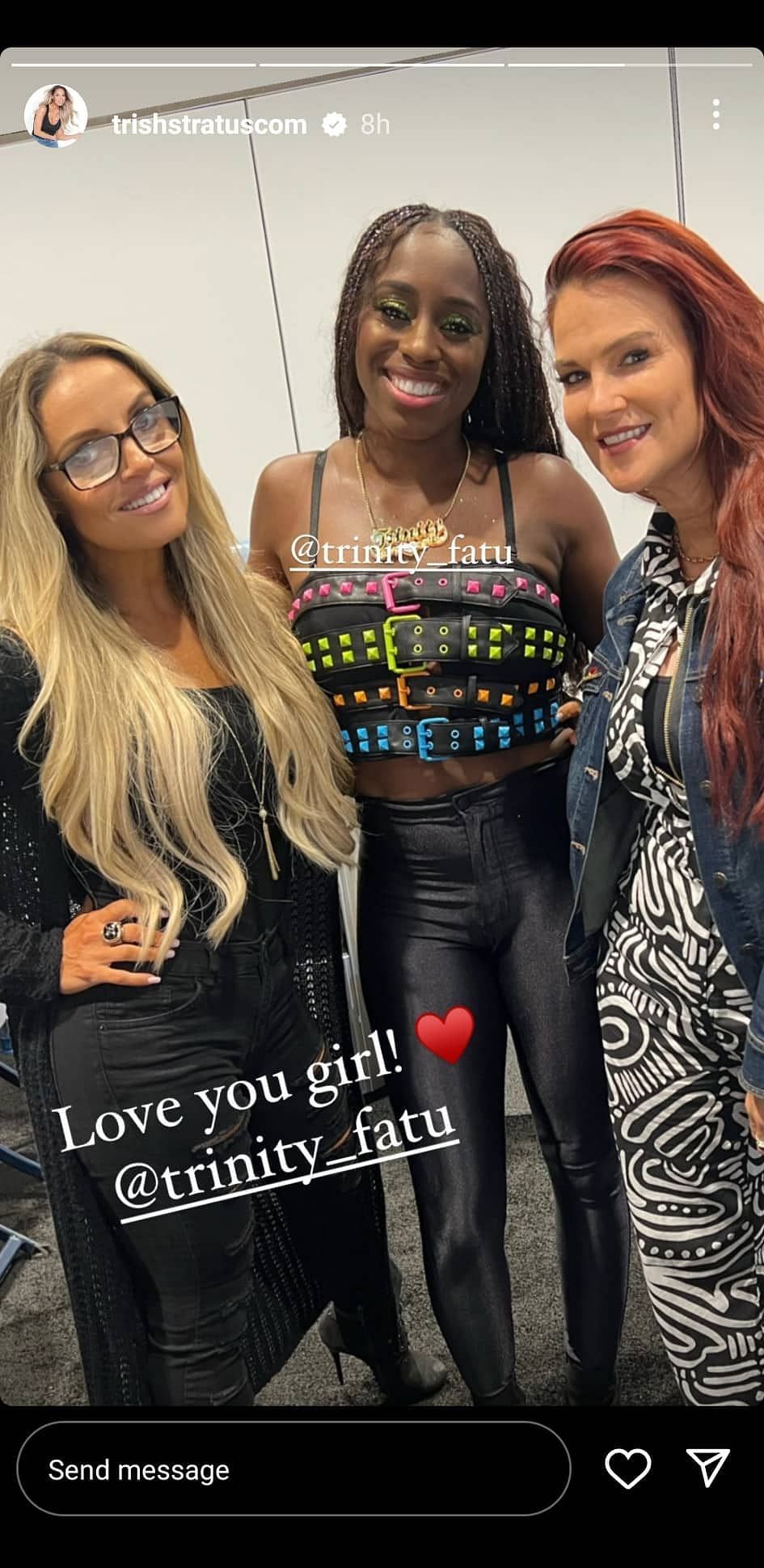 Naomi, alongside Trish Stratus and Lita