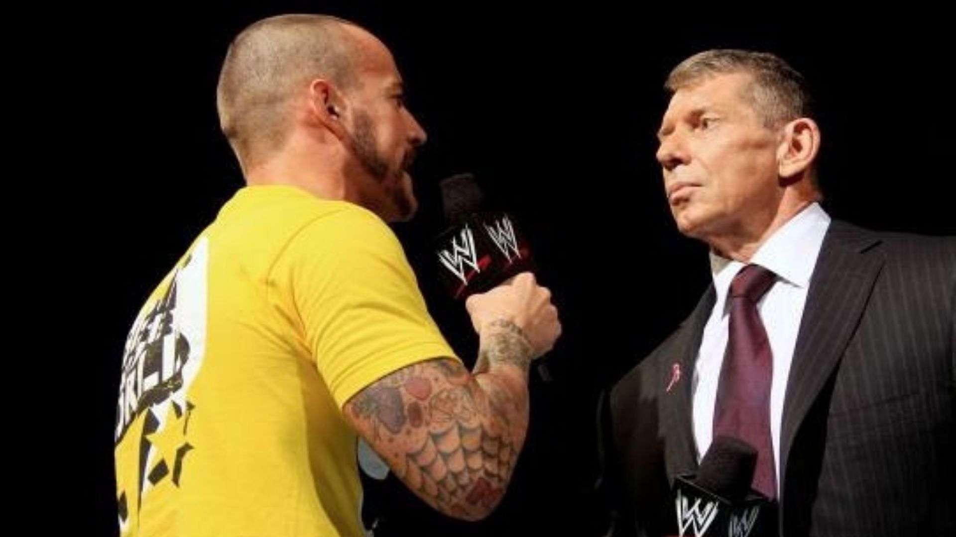 CM Punk and Vince McMahon cutting a promo on each other in 2013
