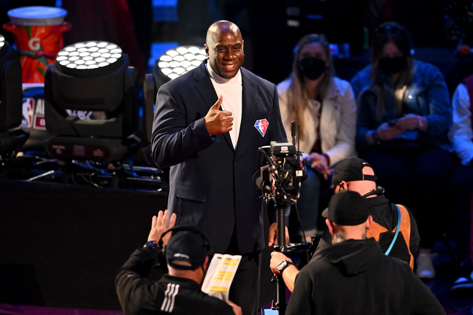 Earvin "Magic" Johnson reacts after being introduced as part of the NBA 75th Anniversary Team during the All-Star Game festivities on Feb. 20, 2022, in Cleveland, Ohio.