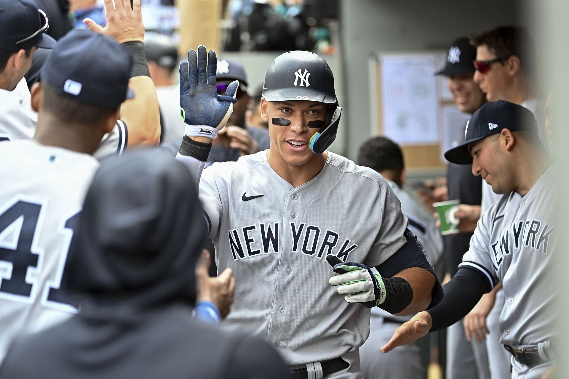 Judge being congratulated in the dugout