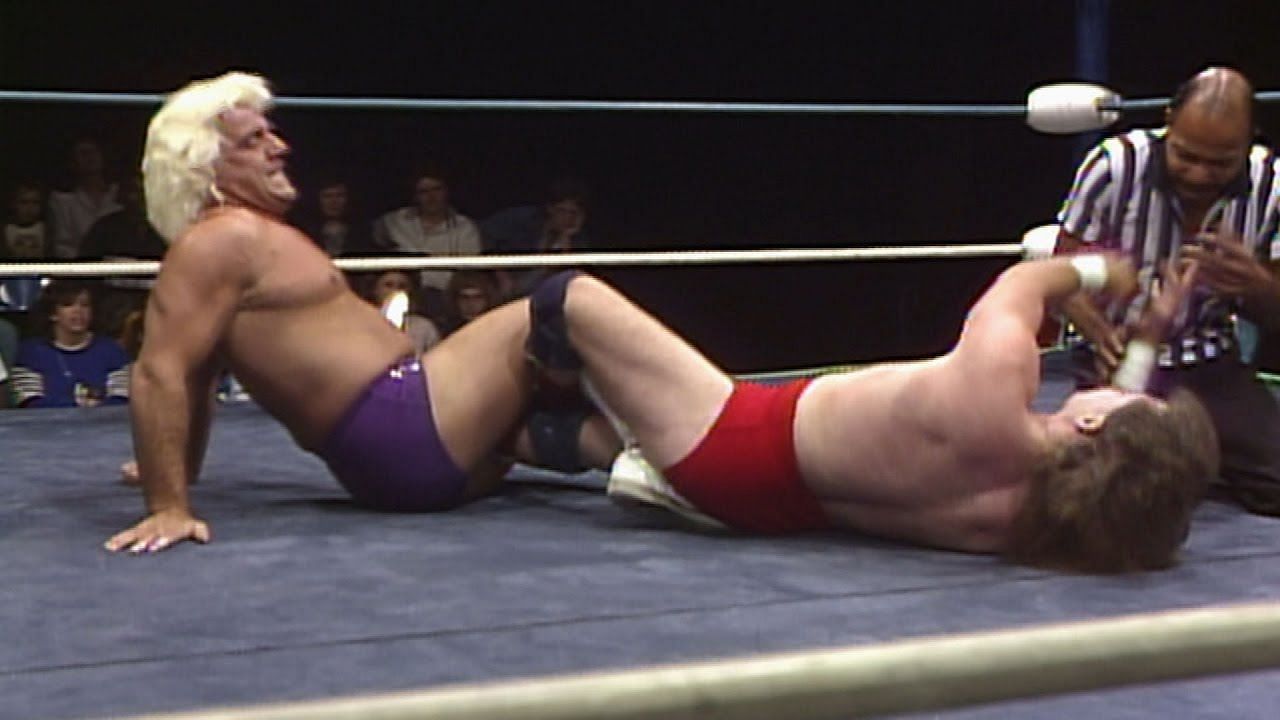 The Nature Boy locks George South in the Figure Four