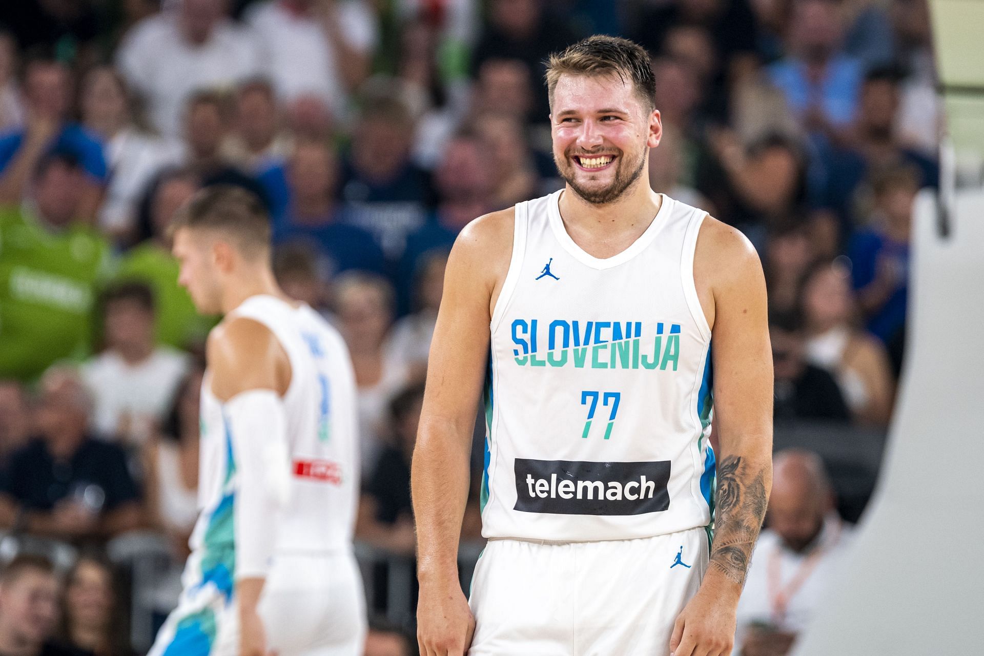 Luka Doncic reacts to a play against Serbia