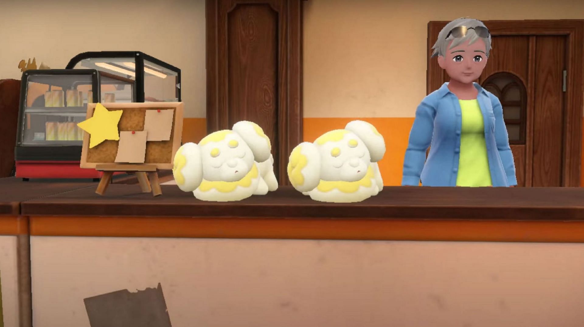 Two Fidough rest on a counter in a recent trailer (Image via Game Freak)