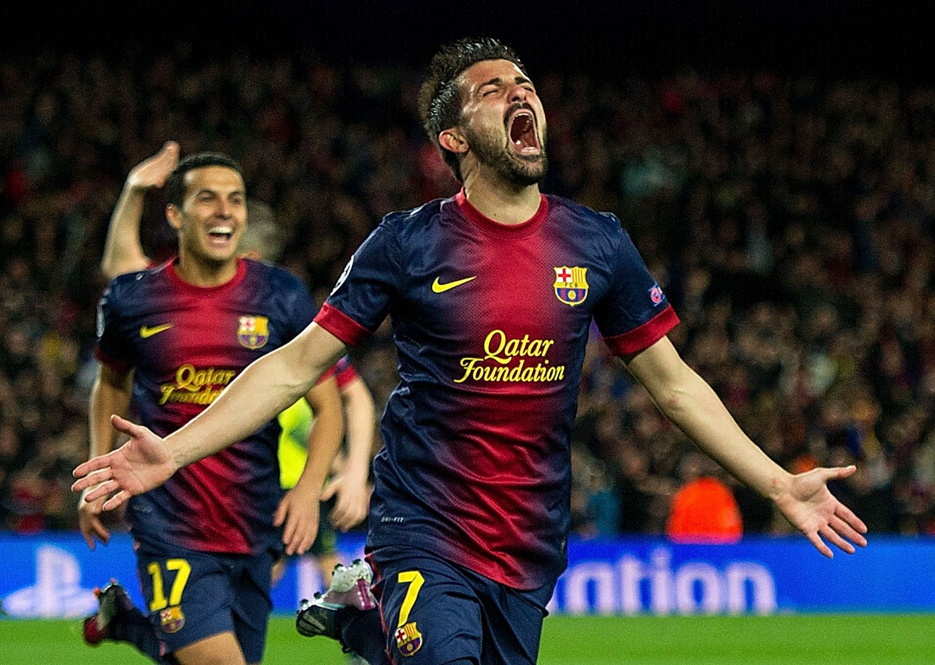 David Villa celebrates after scoring against AC Milan - UEFA Champions League Round of 16