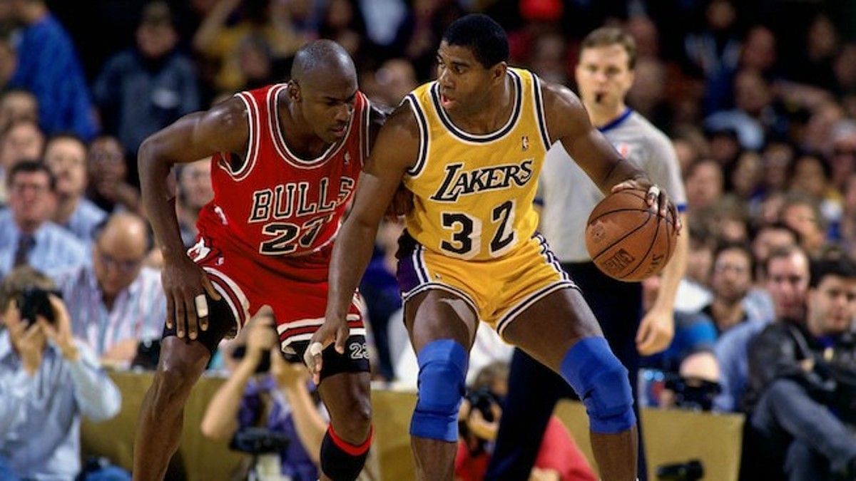 Magic Johnson, right, of the A Lakers posting up against Chicago Bulls&#039; Michael Jordan.