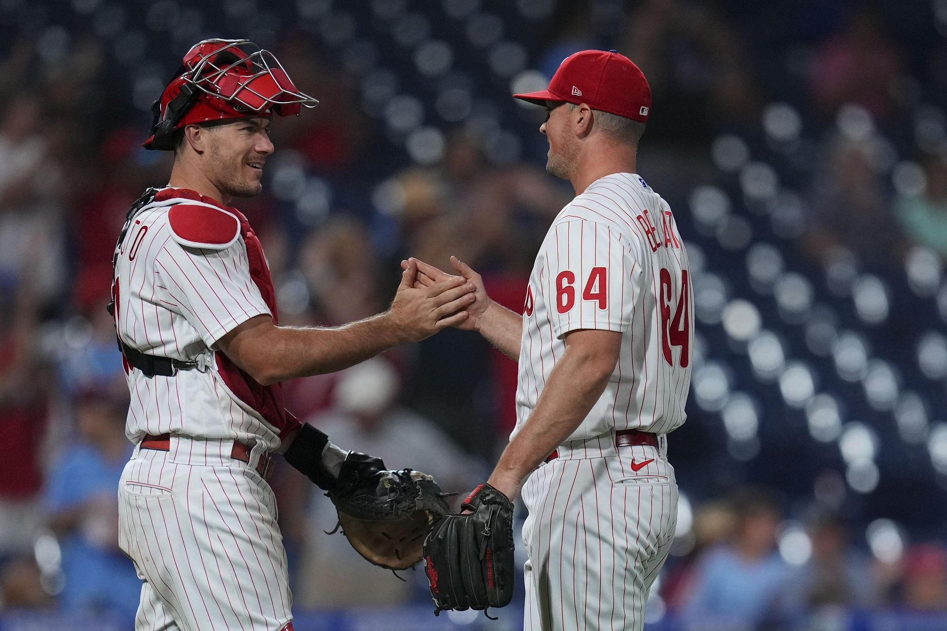 Phillies players celebrate a win over the Cincinnati Reds.