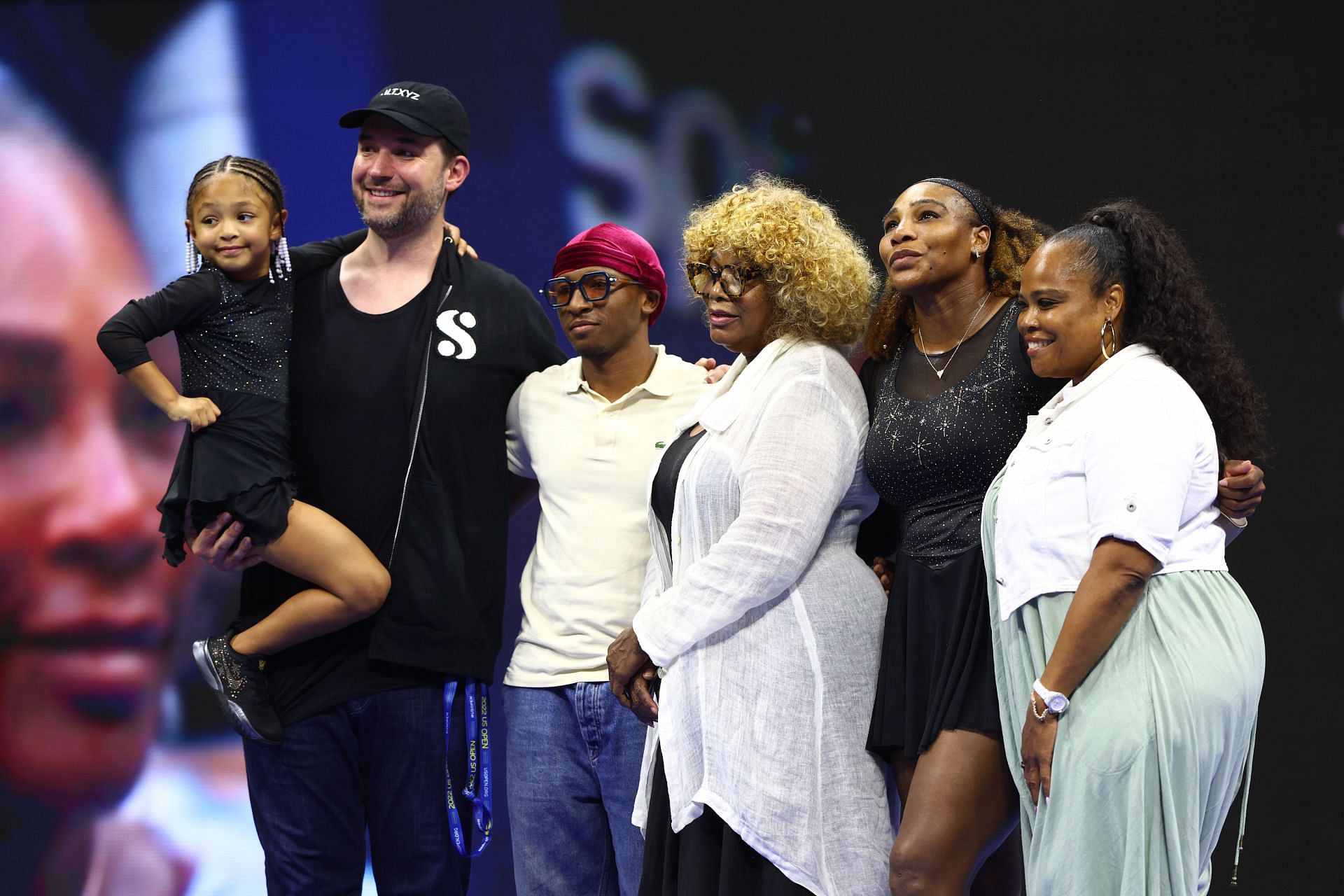 Serena Williams poses for a photo with her family.