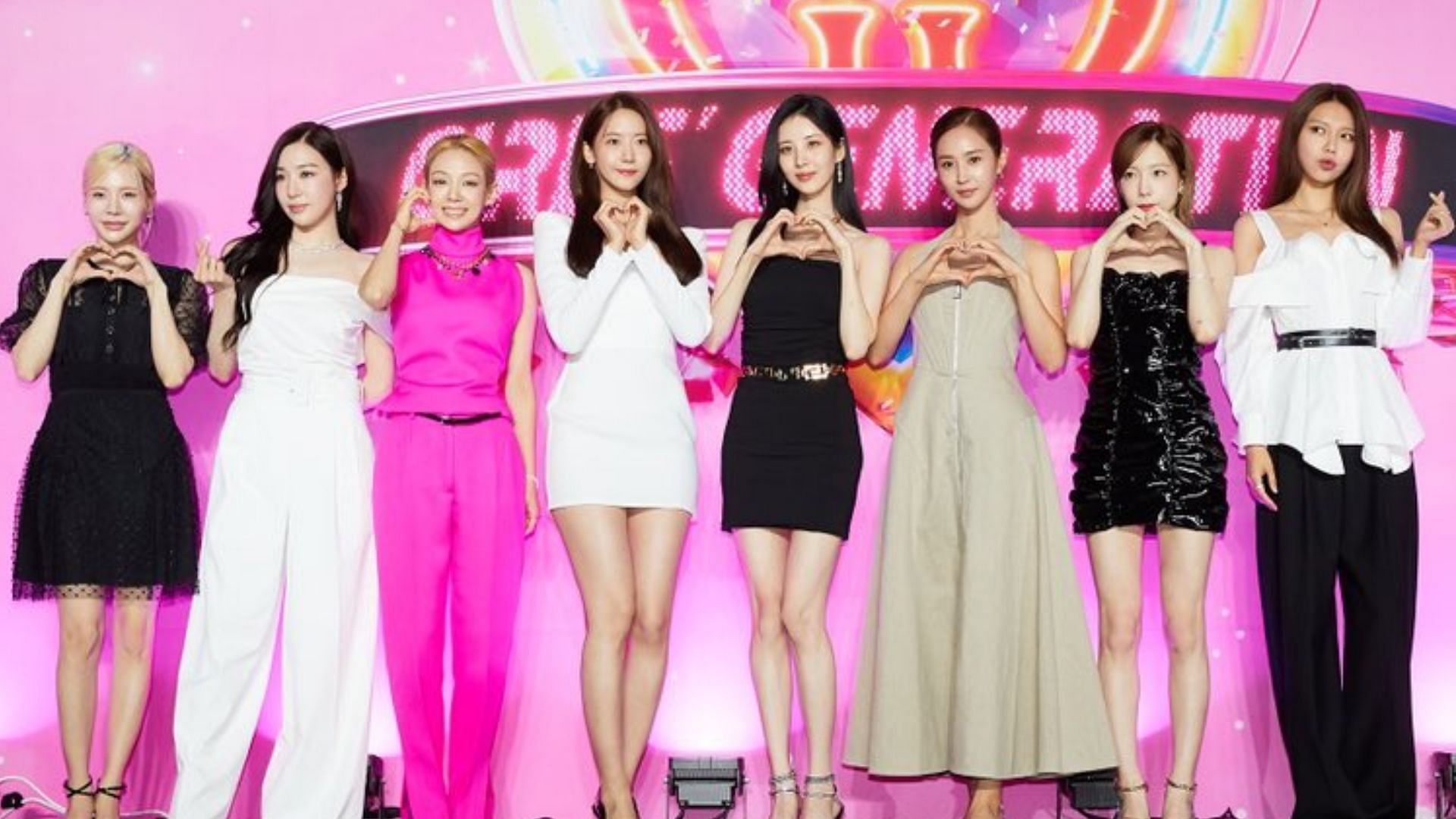 Girls&#039; Generation pose at the press conference of Forever 1 (Image via SM Entertainment)