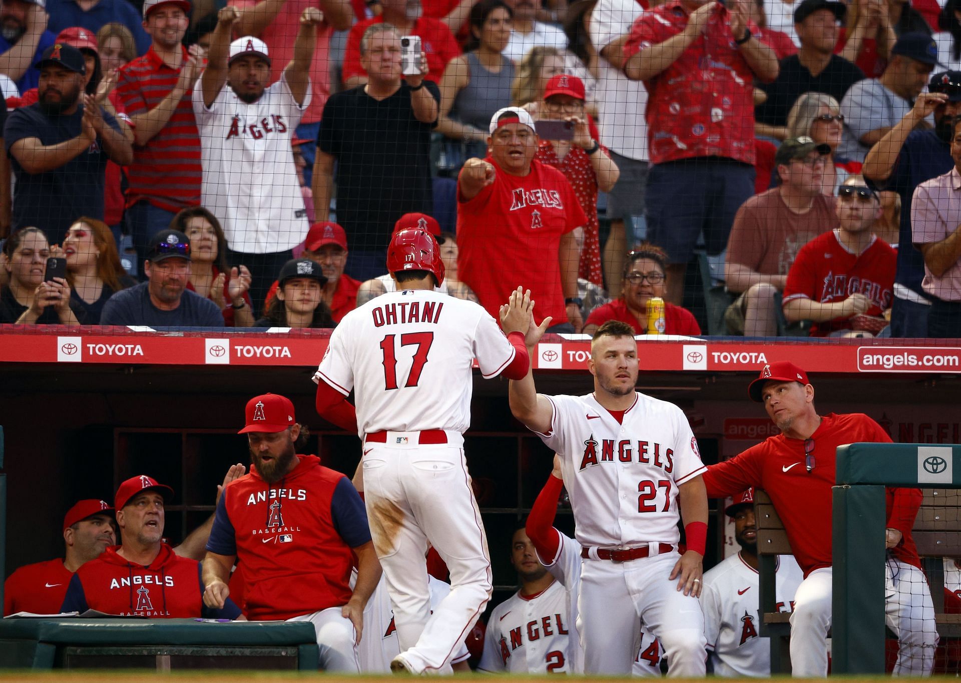 Shohei Ohtani celebrates a run with Mike Trout against the Houston Astros in Anaheim.