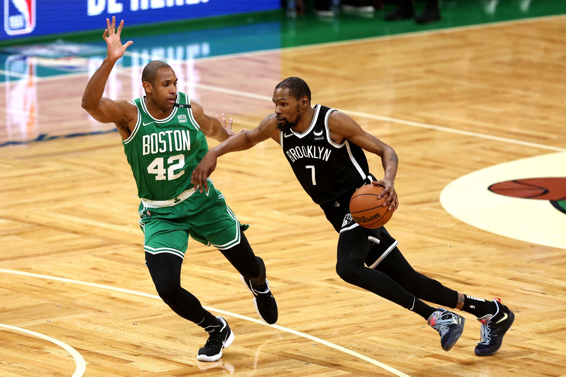 Kevin Durant of the Brooklyn Nets drives toward the basket against Al Horford of the Boston Celtics.