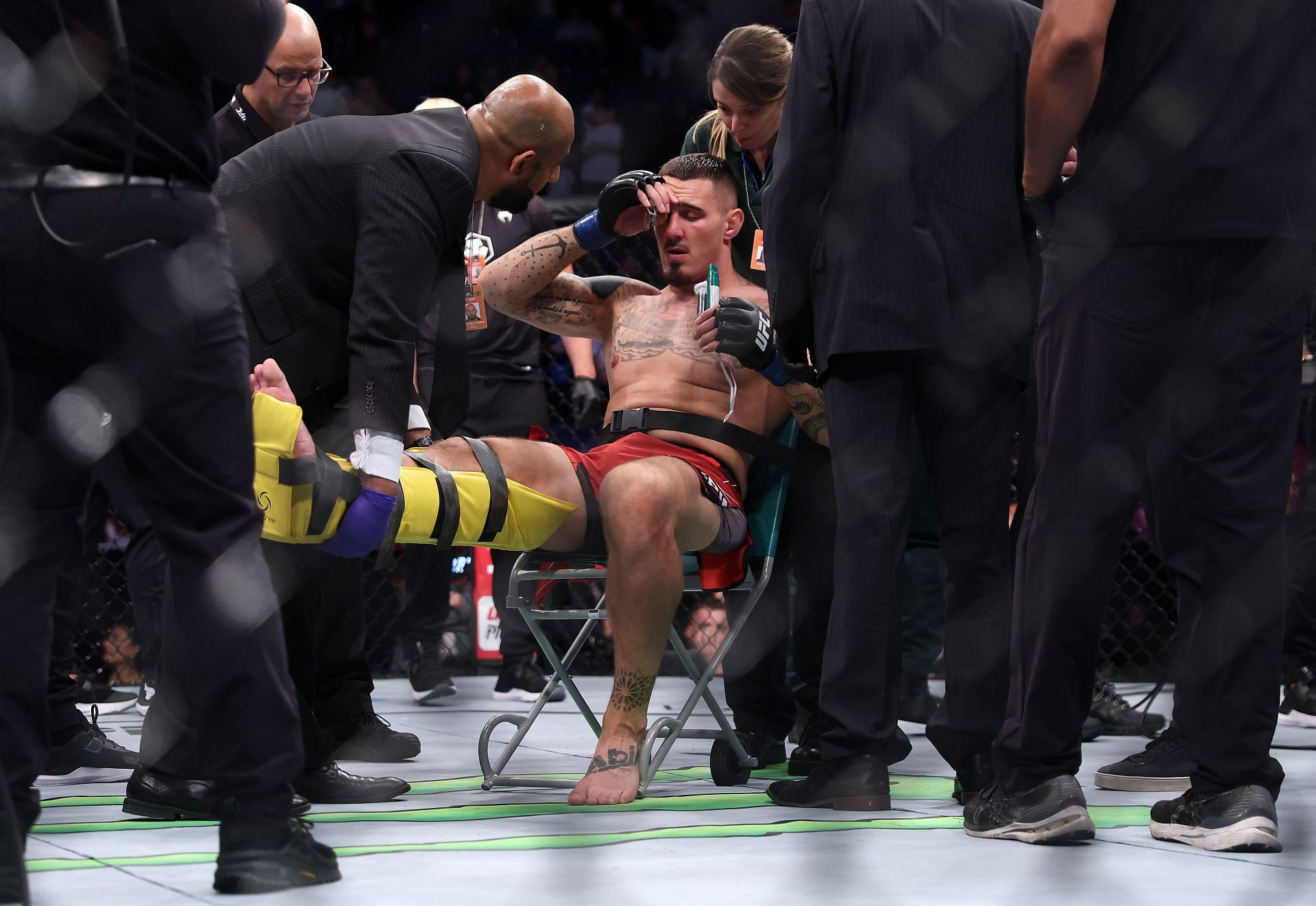 Tom Aspinall after injuring his knee on UFC Fight Night: Blaydes vs. Aspinall (Image via Getty)