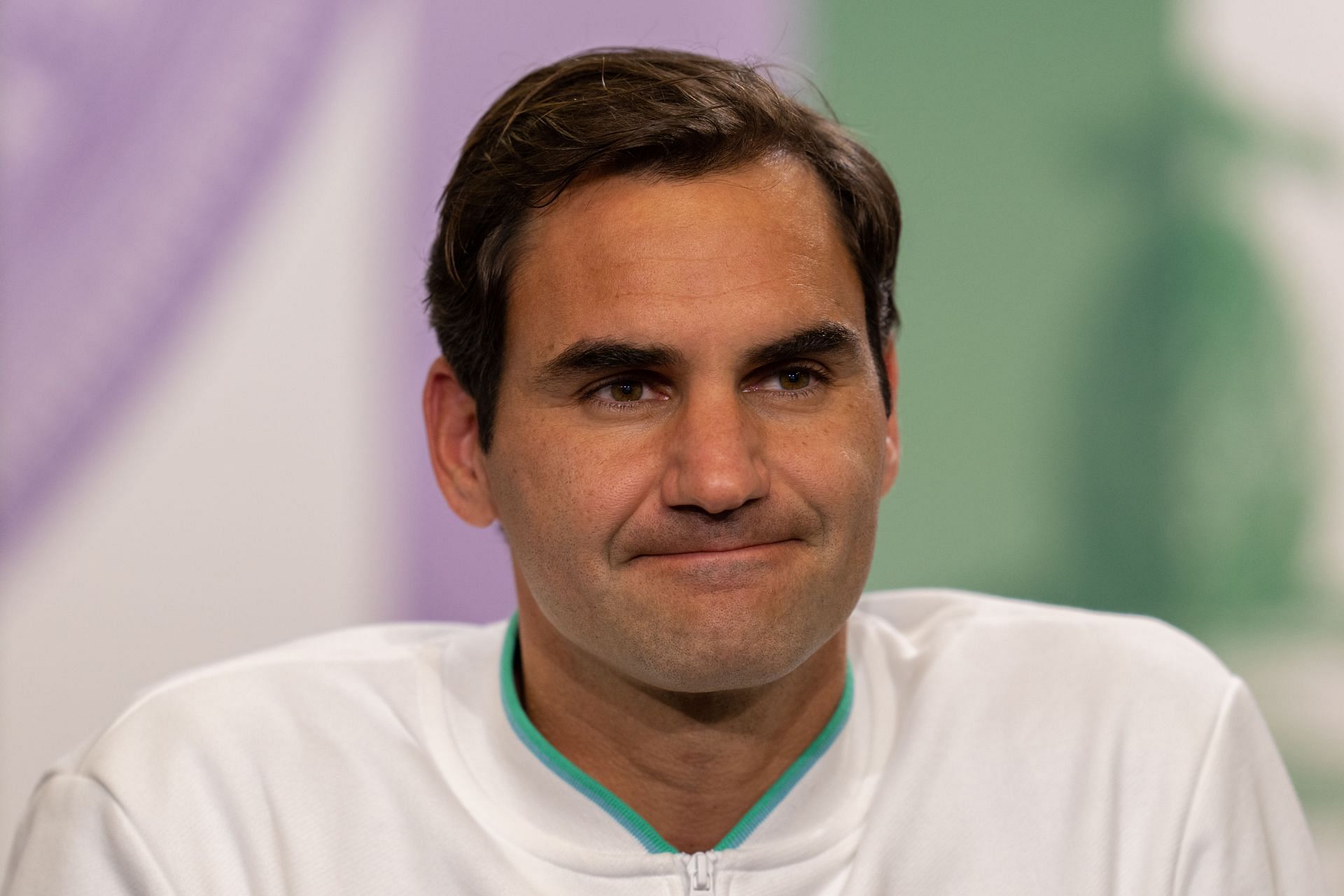 Roger Federer attends a press conference at Wimbledon 2021