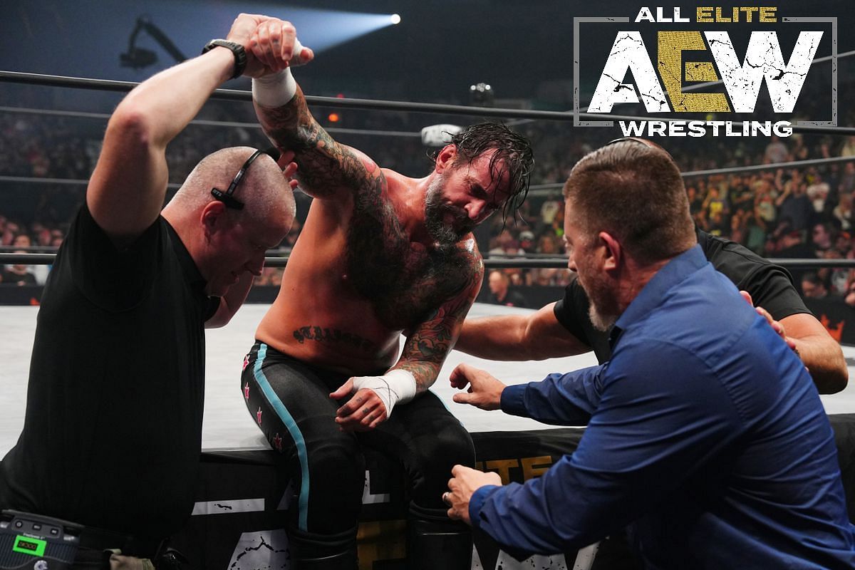 Punk being escorted out of the ring after his match against Jon Moxley weeks ago.