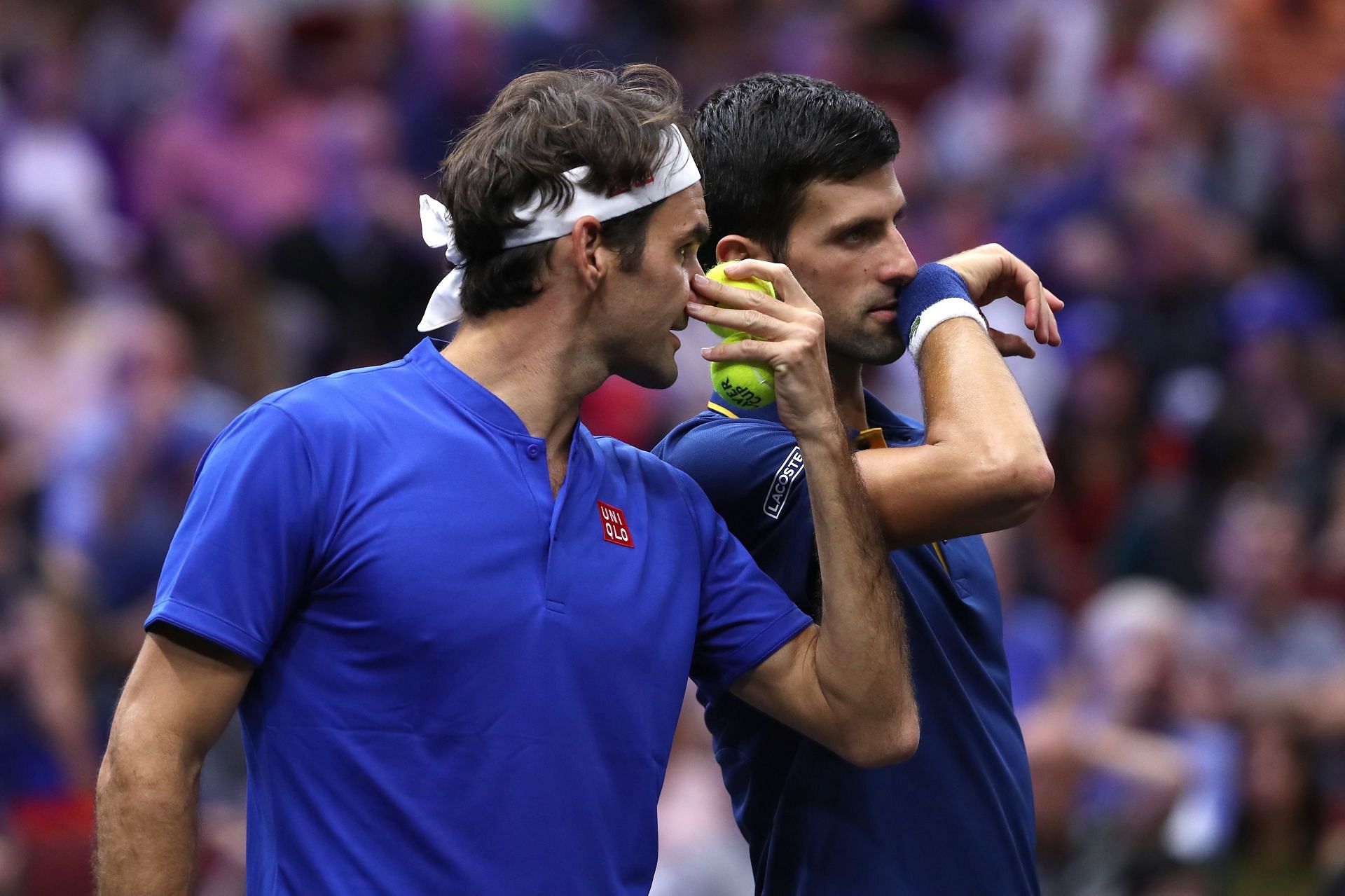 Novak Djokovic and Roger Federer during a doubles match at the 2018 Laver Cup