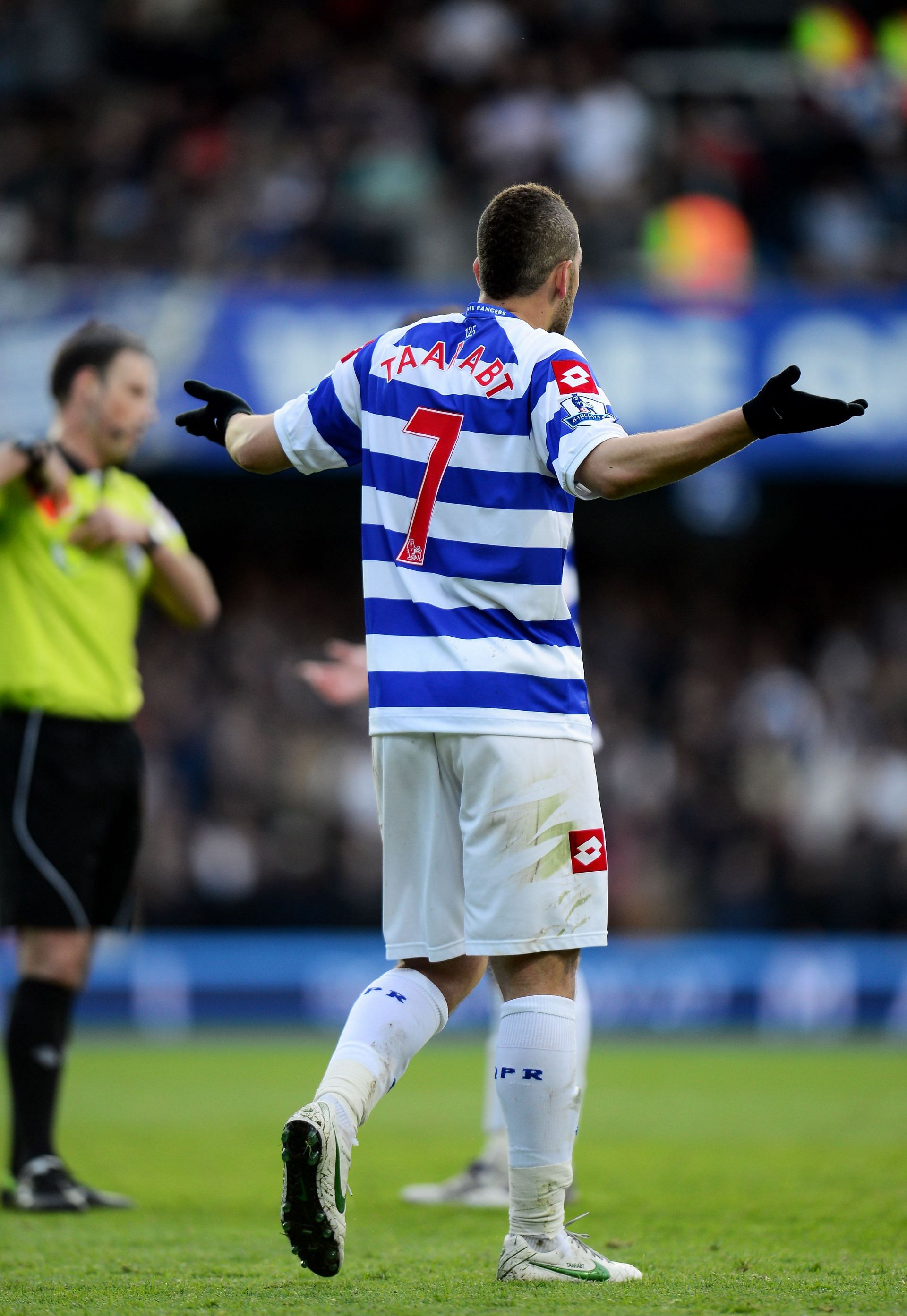 Adel Taarabt of QPR reacts after being shown the red card by Referee Mark Clattenburg for his second bookable offense during the Barclays Premier League match between Queens Park Rangers and Tottenham Hotspur at Loftus Road on April 21, 2012.