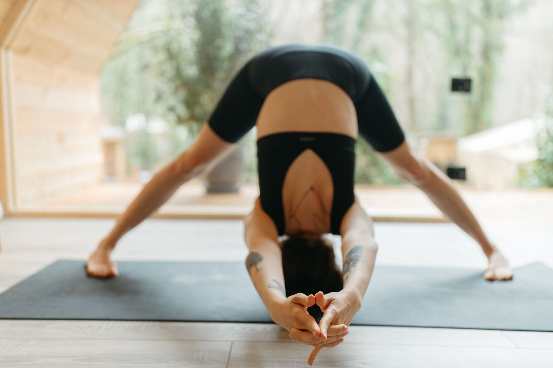 Hip opening yoga poses help to relieve stress and tension (Image via Pexels @Anastasia Shuraeva