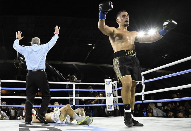 How much money did AnEsonGib earn by knocking out Austin McBroom?