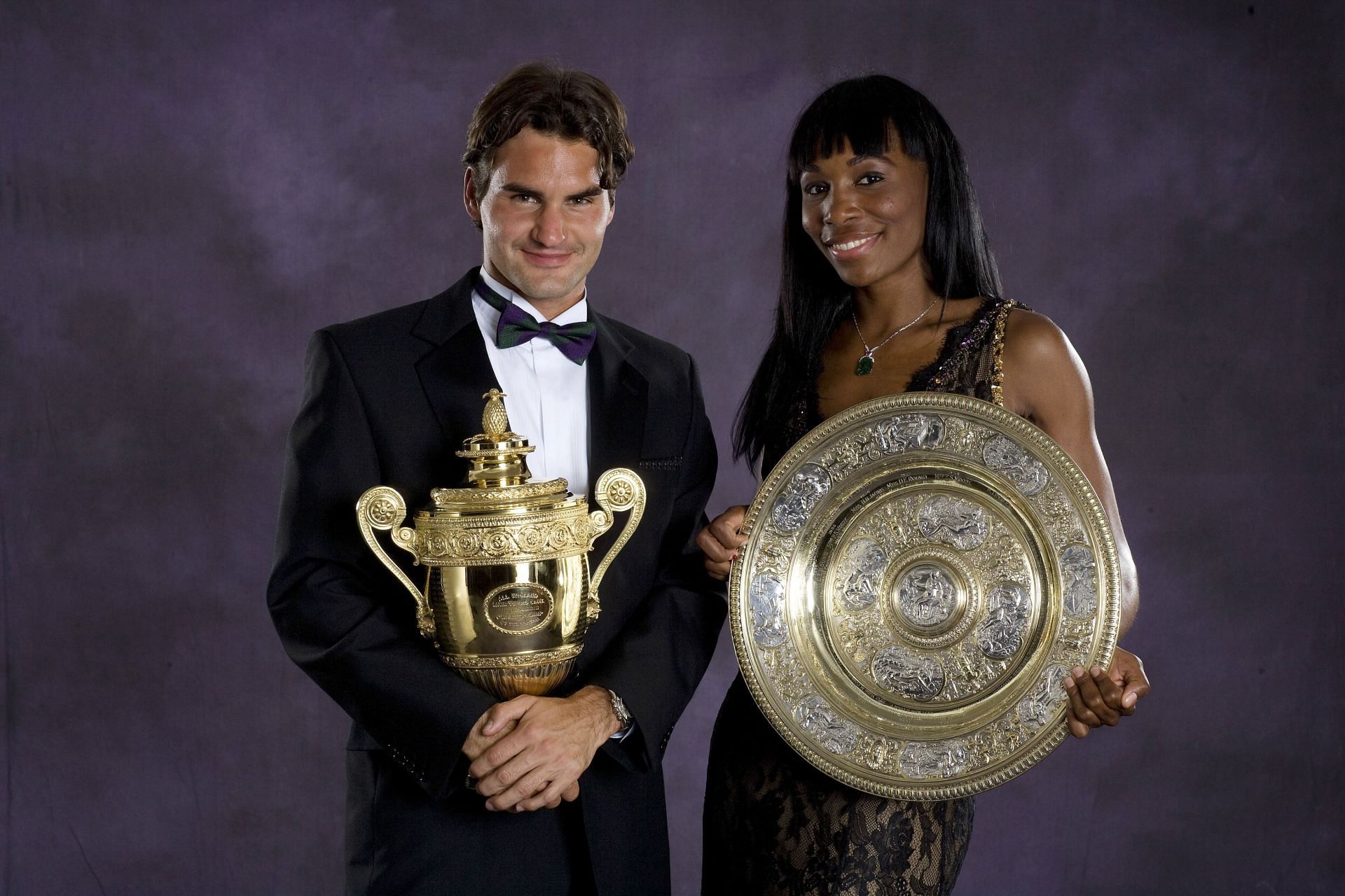 Roger Federer and Venus Williams with their respective 2007 Wimbledon titles.