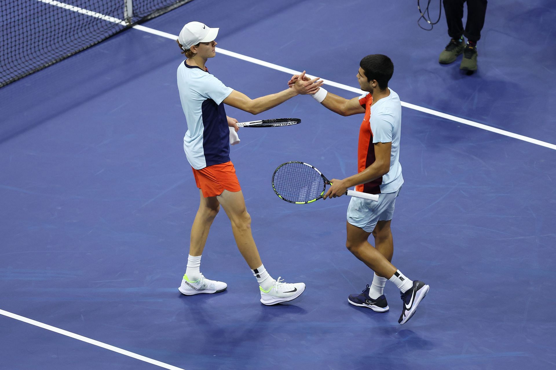 Jannik Sinner and Carlos Alcaraz shake hands after their 2022 US Open quarterfinal.