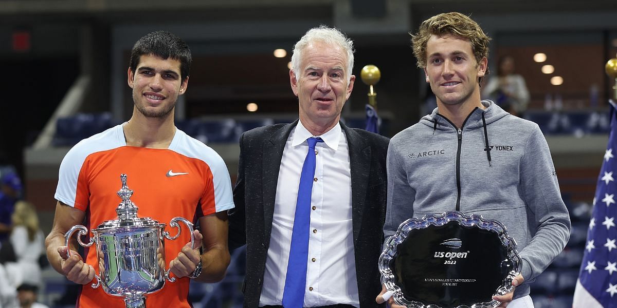 John McEnroe flanked by the US Open finalists
