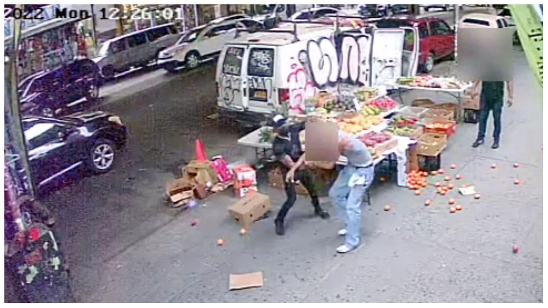 The accused is believed to be in the middle of (image via NYPD)