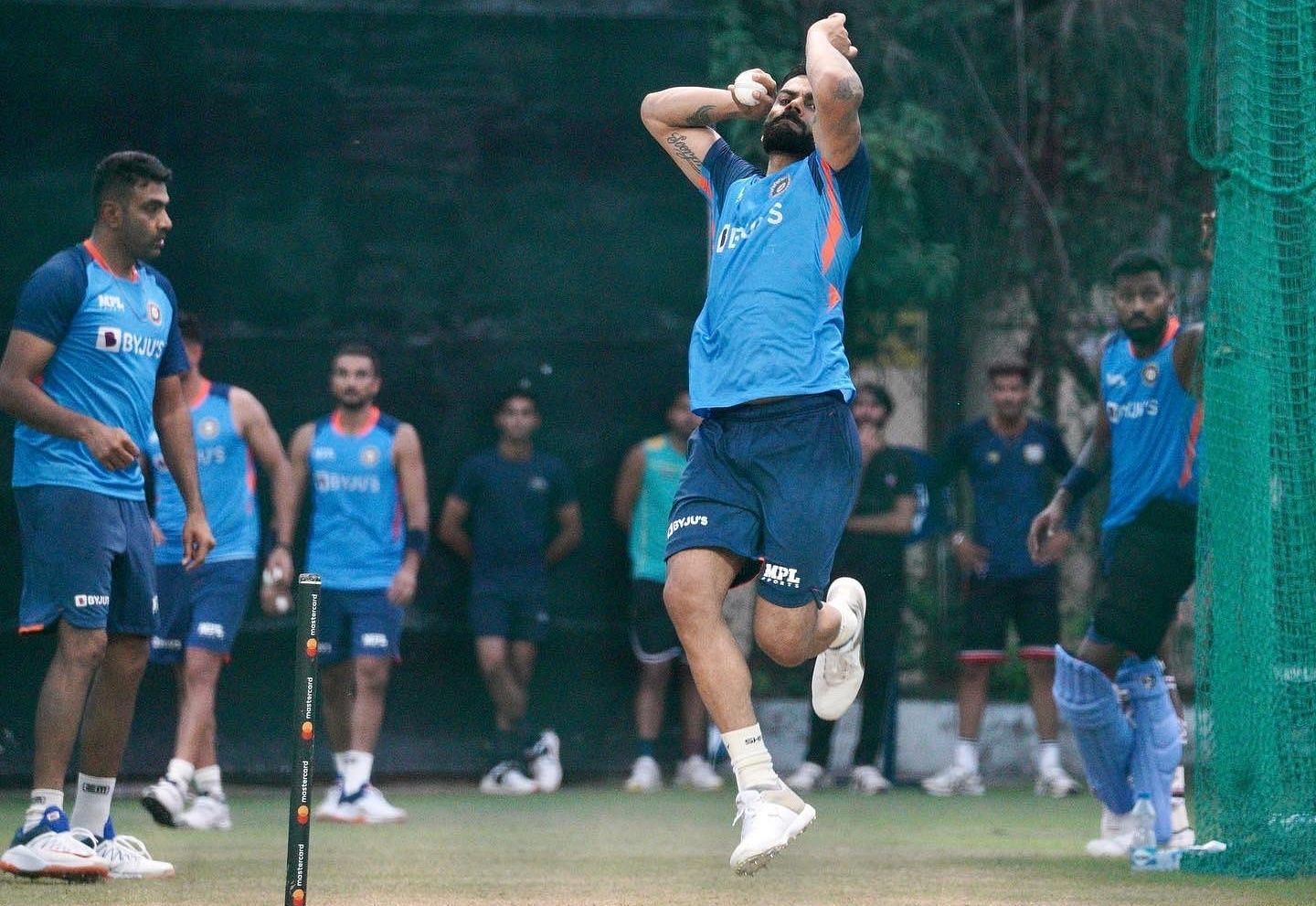 The former India captain bowls in the nets.