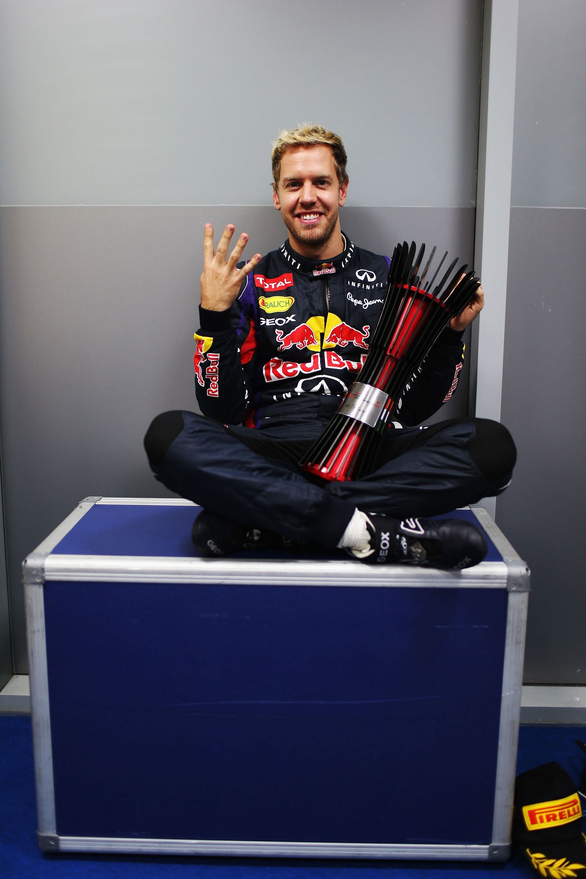 Race winner Sebastian Vettel of Germany and Infiniti Red Bull Racing celebrates his fourth consecutive F1 World Championship following the Indian Formula One Grand Prix at Buddh International Circuit on October 27, 2013 in Noida, India. (Photo by Mark Thompson/Getty Images)