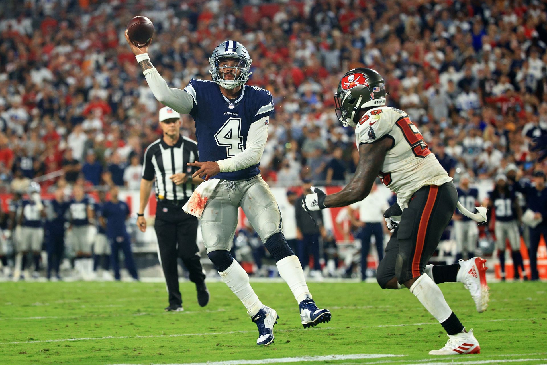 Dallas Cowboys quarterback Dak Prescott wears a Crucial Catch hat as he  warms up for an NFL football game against the Houston Texans, Sunday, Oct.  7, 2018, in Houston. (AP Photo/David J.