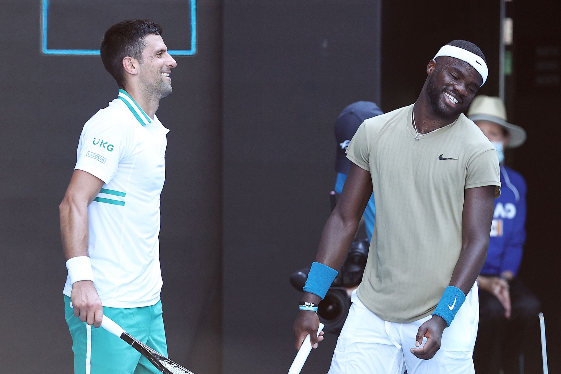 Novak Djokovic (L) and Frances Tiafoe