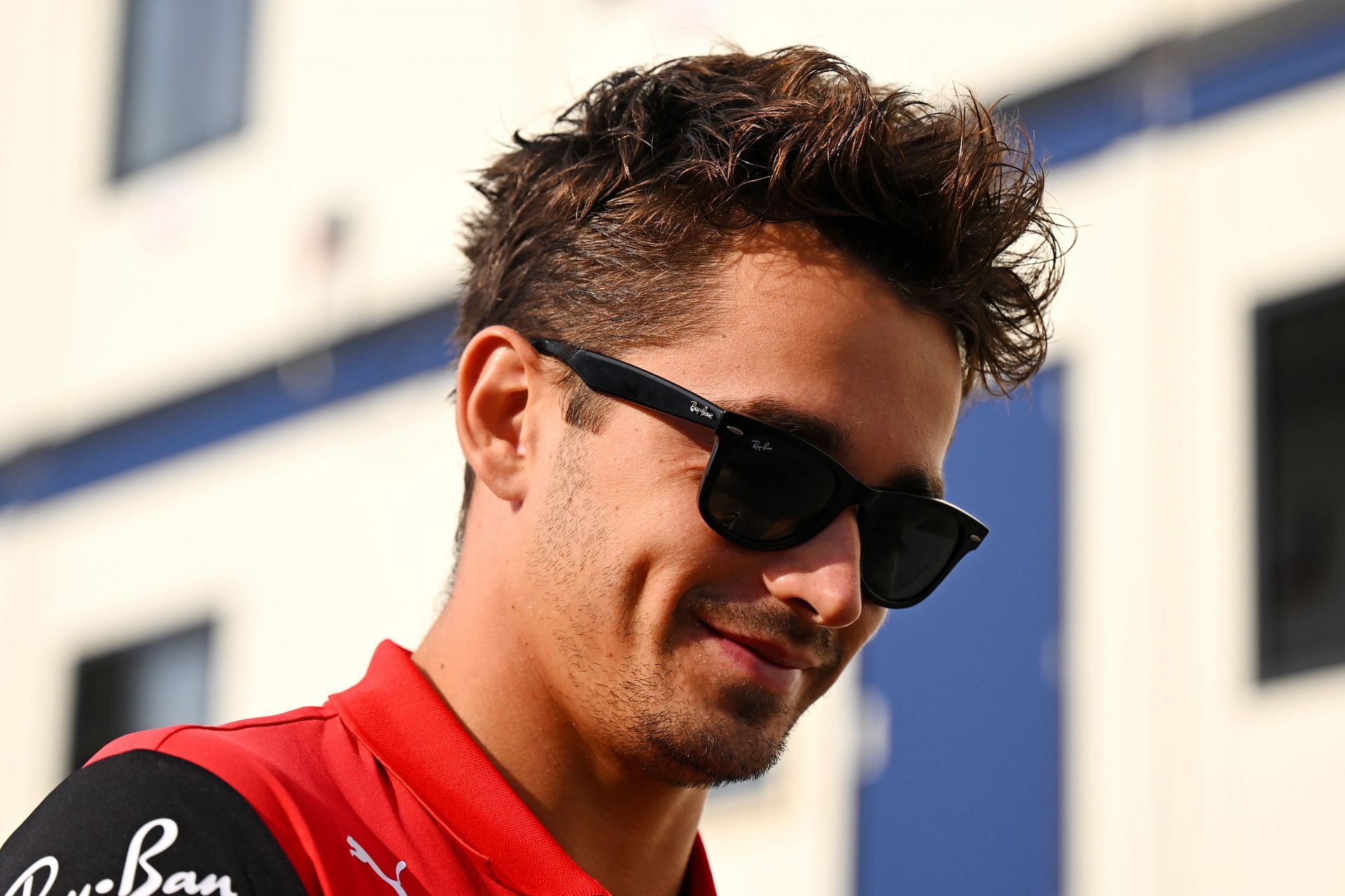 Charles Leclerc of Monaco and Ferrari arrives at the circuit and walks in the Paddock prior to practice ahead of the F1 Grand Prix of The Netherlands at Circuit Zandvoort (Photo by Clive Mason/Getty Images)