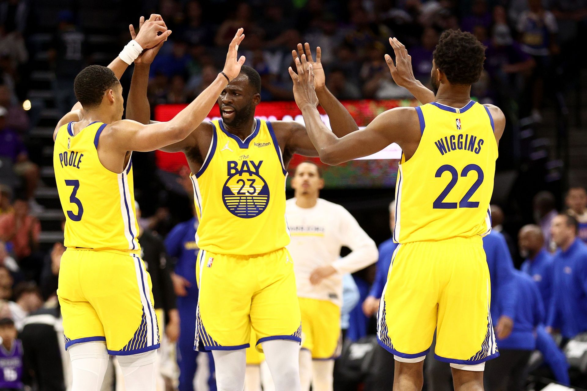 Jordan Poole, Draymond Green and Andrew Wiggins