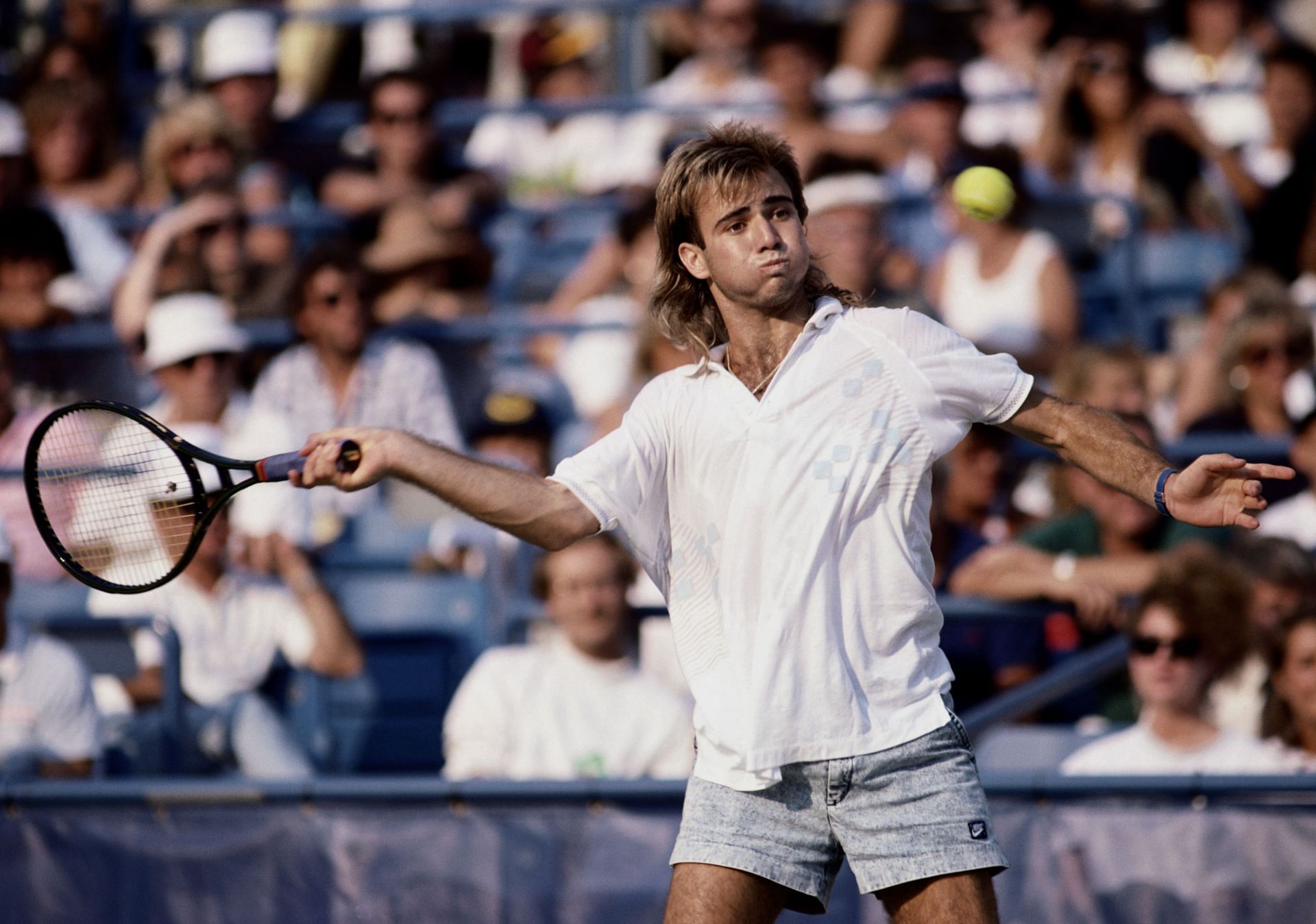 Andre Agassi attempts a forehand