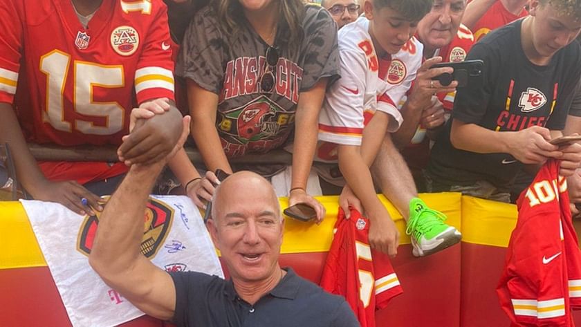Doesn't look like a real human' - Jeff Bezos trolled by social media for  absurd handshake with Chiefs fan at Arrowhead Stadium