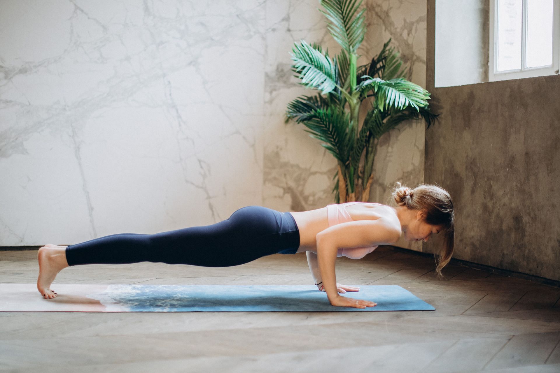 Plank pose helps in strengthening your core and chest muscles. (Image via Pexels / Elina Fairytale)