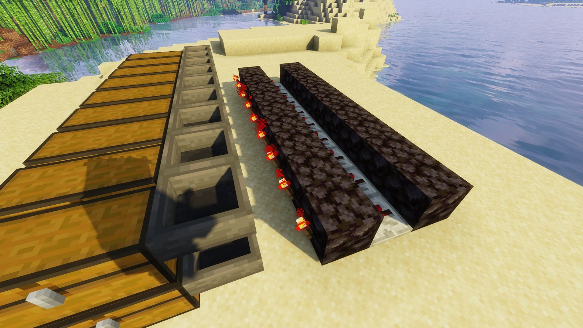 The redstone torches placed between the hoppers and the repeaters (Image via Minecraft)