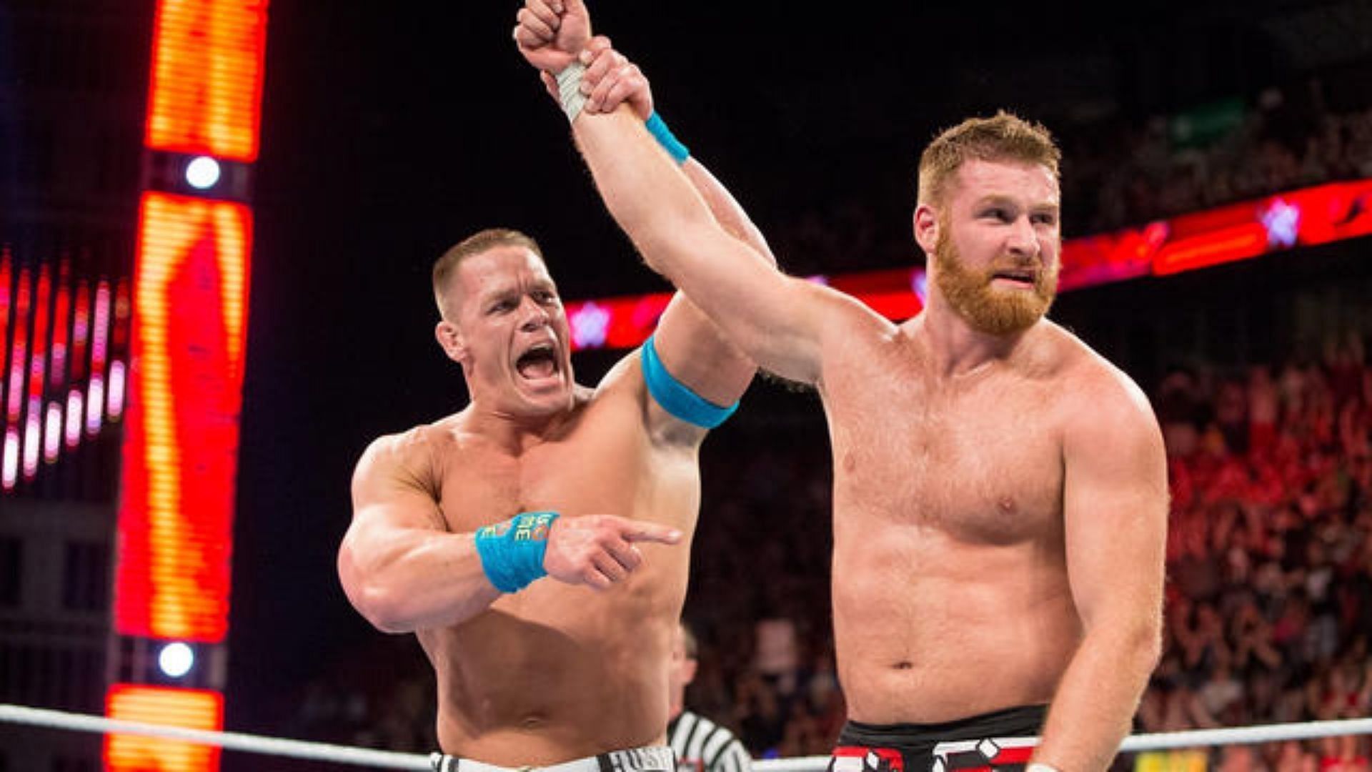 John Cena congratulates Sami Zayn for his valiant effort.