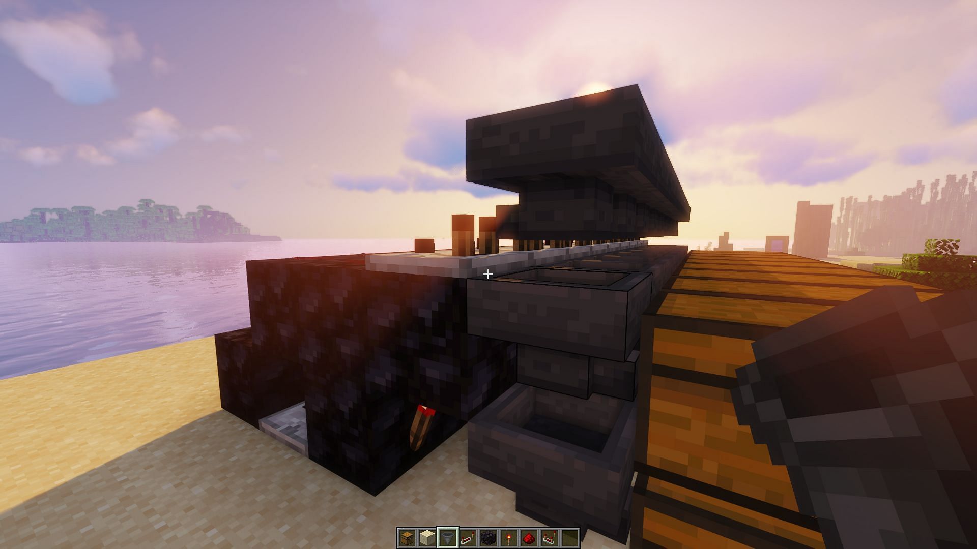 The row of hoppers placed flowing into the redstone comparators (Image via Minecraft)