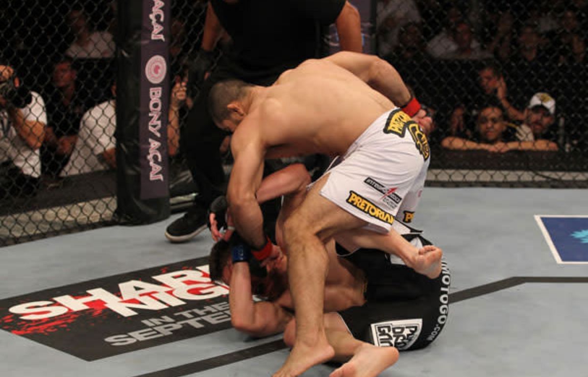 Rousimar Palhares scaled the fence to celebrate his win over Dan Miller - despite the fight not actually being over